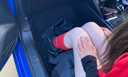 Sitting on a Soccersac easy fit car seat cover