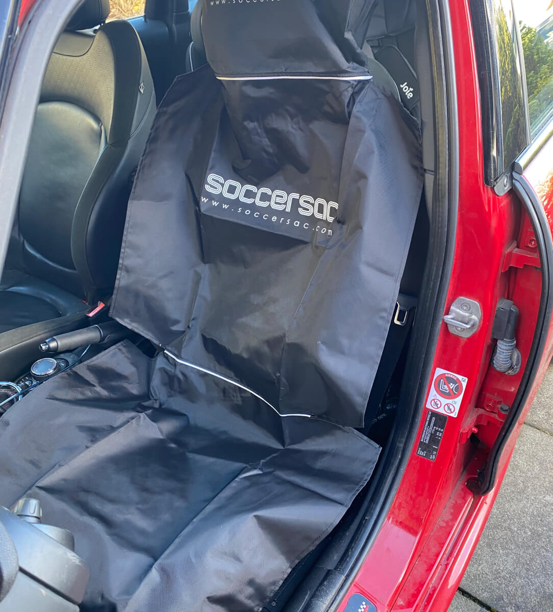 Soccersac in front seat of a mini